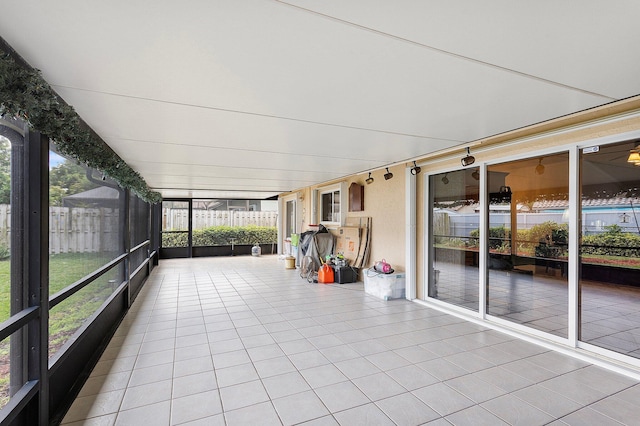 unfurnished sunroom featuring plenty of natural light