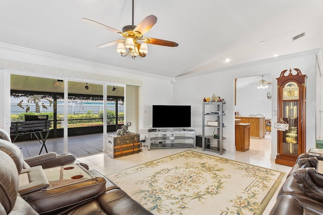 living room featuring lofted ceiling, light tile patterned floors, crown molding, and ceiling fan