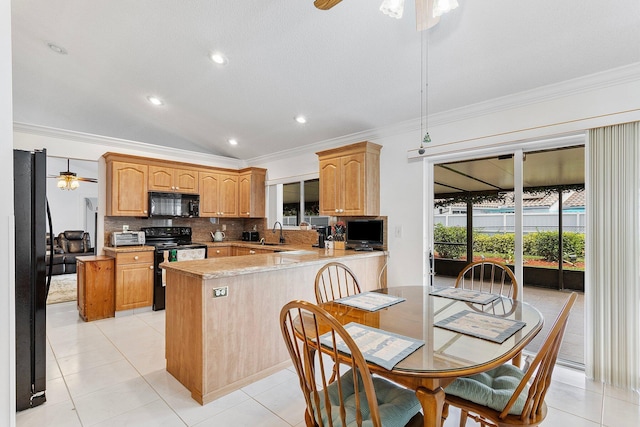 kitchen featuring sink, black appliances, kitchen peninsula, and ceiling fan