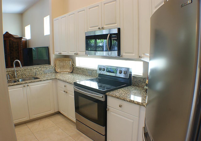 kitchen featuring white cabinetry, appliances with stainless steel finishes, and sink