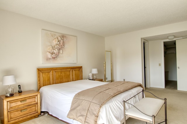 carpeted bedroom with a textured ceiling