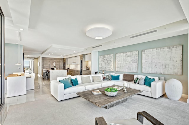 living room with light tile patterned floors