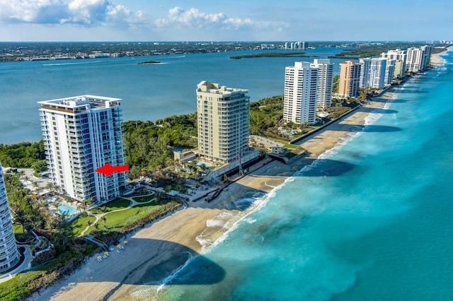 birds eye view of property featuring a water view and a view of the beach