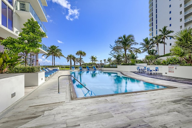 view of pool featuring a patio