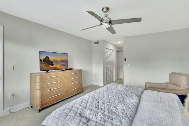 carpeted bedroom with a closet and ceiling fan