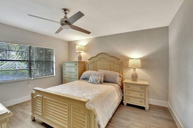 bedroom with ceiling fan and light hardwood / wood-style floors