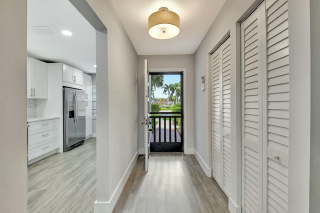 doorway with light hardwood / wood-style floors