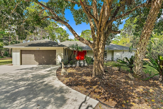 single story home with a garage