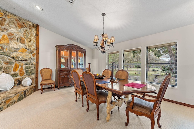 dining room featuring lofted ceiling, a textured ceiling, light carpet, and a notable chandelier