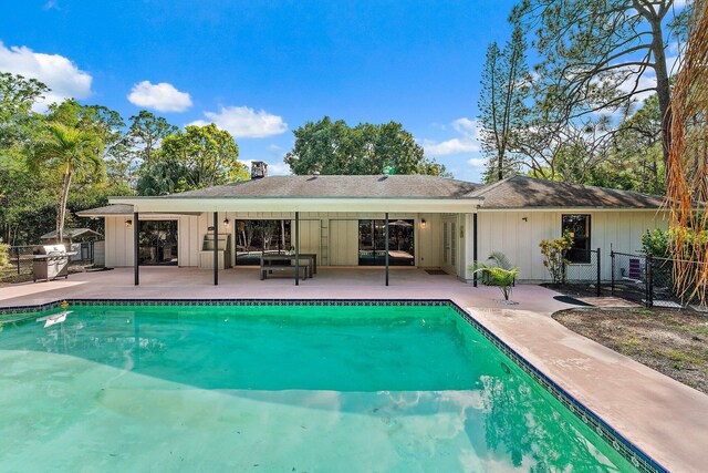 view of swimming pool with a patio area