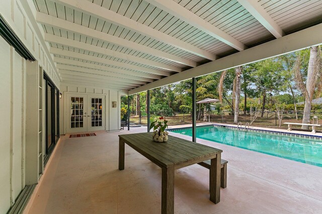 view of pool with a patio and french doors