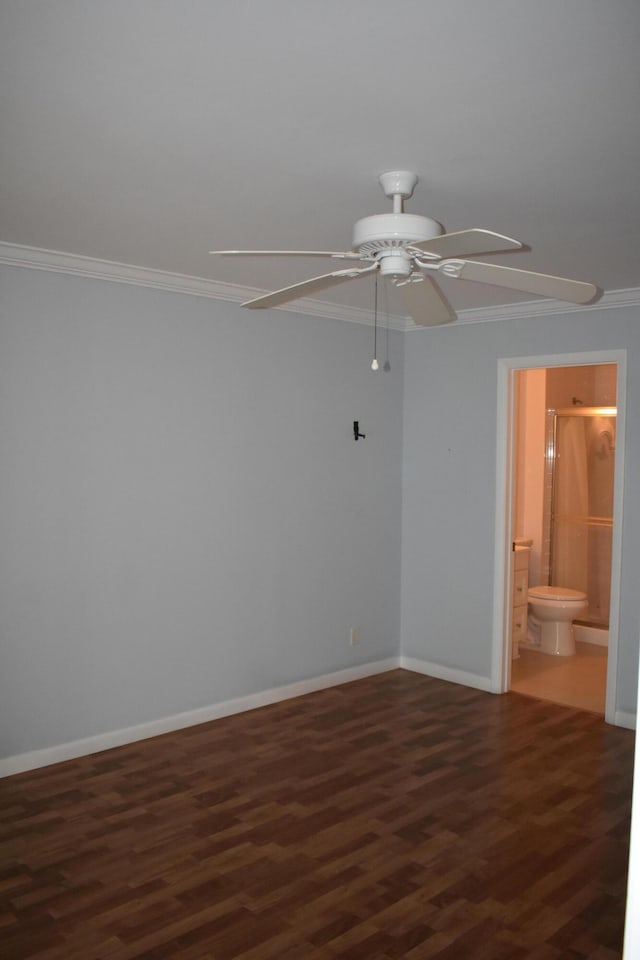 unfurnished room with ornamental molding, dark wood-type flooring, and ceiling fan