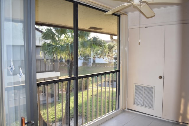 exterior space featuring ceiling fan