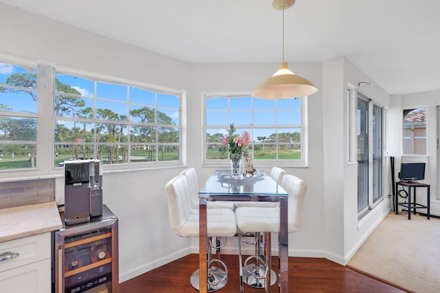 dining space featuring dark hardwood / wood-style floors