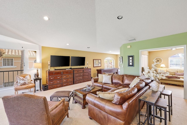 living room with light carpet and a textured ceiling