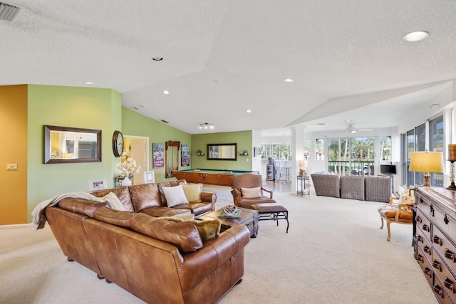 living room featuring lofted ceiling, pool table, light carpet, and ornate columns