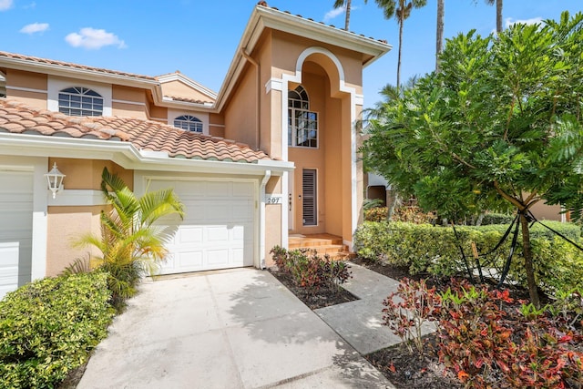 mediterranean / spanish-style home featuring a garage