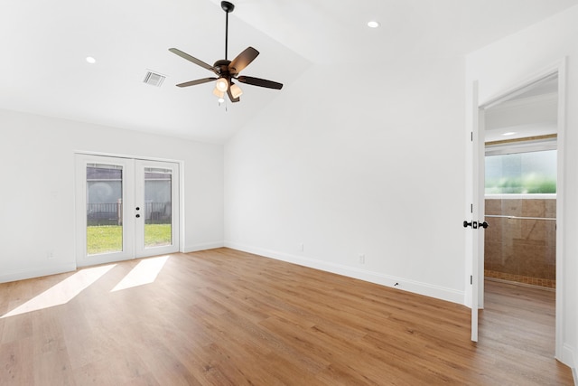 unfurnished living room featuring french doors, ceiling fan, vaulted ceiling, and light hardwood / wood-style flooring