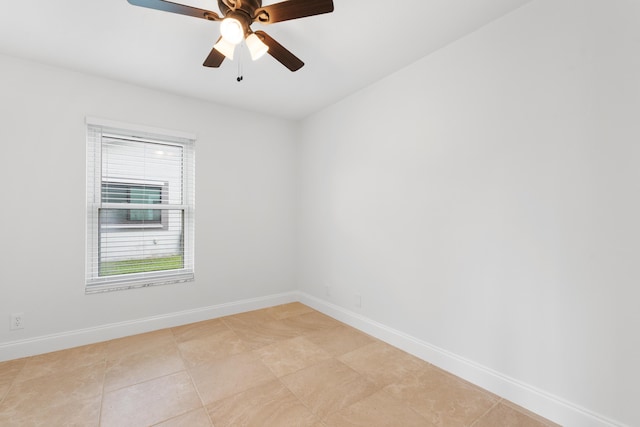 empty room with light tile patterned floors and ceiling fan