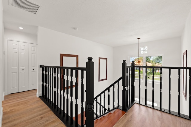 hall with light hardwood / wood-style floors