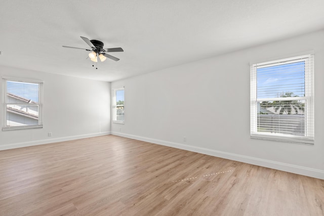 spare room featuring ceiling fan and light hardwood / wood-style flooring