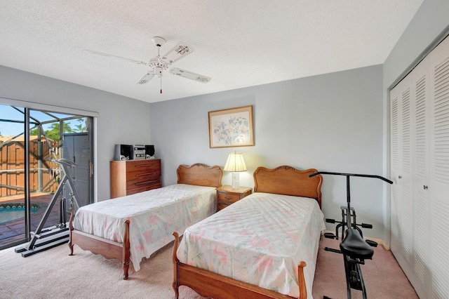 carpeted bedroom featuring ceiling fan, a textured ceiling, a closet, and access to outside