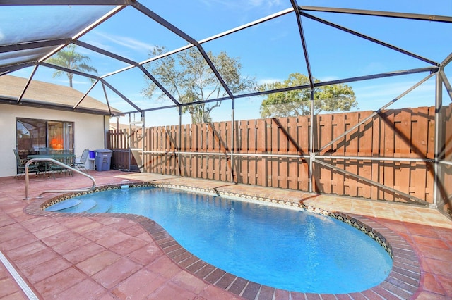 view of pool featuring a lanai and a patio