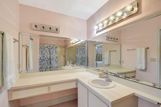 bathroom featuring vanity and a shower with shower curtain