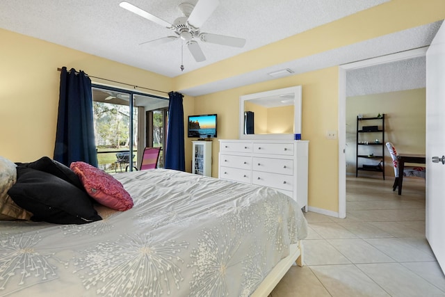 bedroom featuring a ceiling fan, light tile patterned flooring, a textured ceiling, access to outside, and baseboards