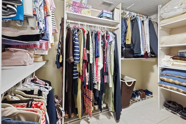 spacious closet featuring tile patterned flooring and visible vents