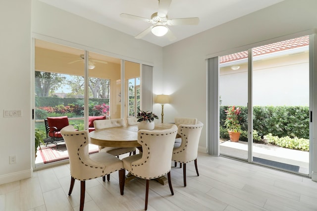 dining area with a healthy amount of sunlight and ceiling fan