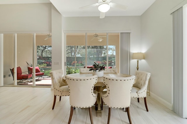 dining room with hardwood / wood-style flooring, a healthy amount of sunlight, and ceiling fan