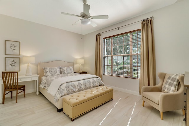 bedroom featuring ceiling fan and light hardwood / wood-style flooring