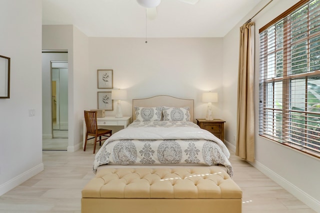 bedroom with ceiling fan and light hardwood / wood-style floors