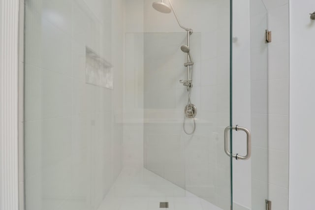 bathroom featuring an enclosed shower