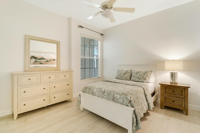 bedroom with light hardwood / wood-style flooring and ceiling fan