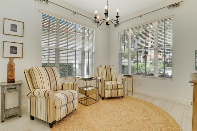 living area featuring a chandelier