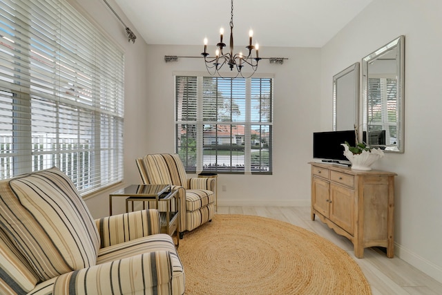 living area featuring an inviting chandelier