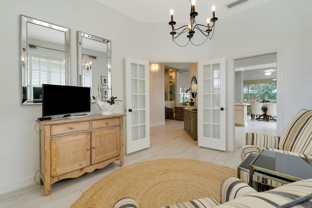 interior space with a healthy amount of sunlight, ceiling fan, and french doors