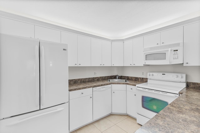 kitchen with white cabinetry, sink, white appliances, and light tile patterned floors