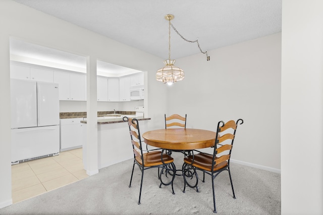 dining room with light colored carpet