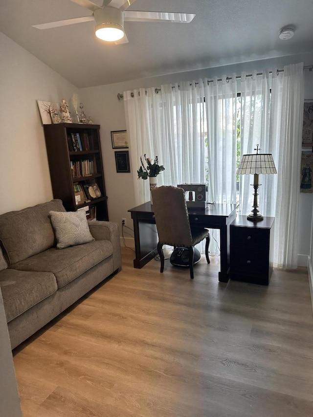 office featuring hardwood / wood-style floors and ceiling fan