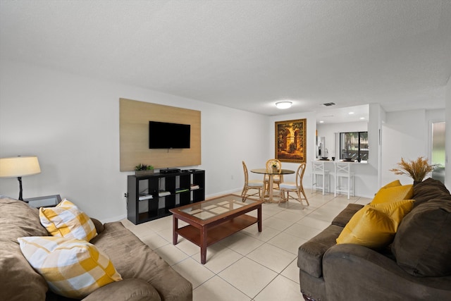 tiled living room with a textured ceiling