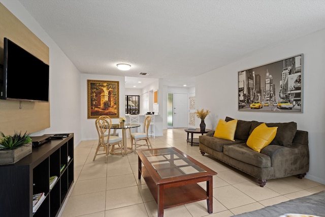 tiled living room with a textured ceiling