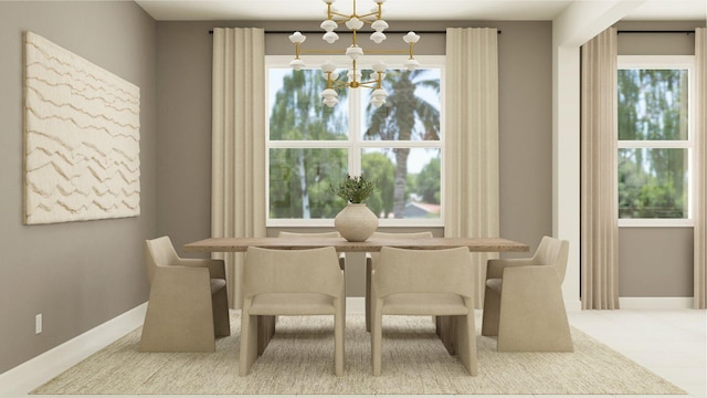 dining area featuring a chandelier and a wealth of natural light