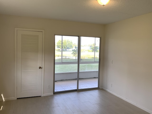 empty room with a textured ceiling