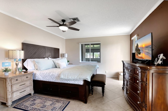 bedroom featuring ornamental molding, light tile patterned floors, a textured ceiling, and ceiling fan