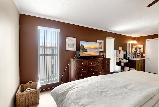 bedroom featuring crown molding and a textured ceiling