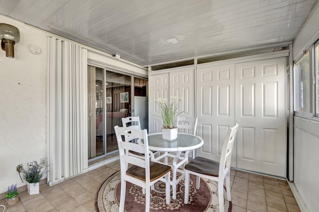 dining area with light tile patterned floors