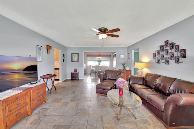 living room featuring a textured ceiling and ceiling fan